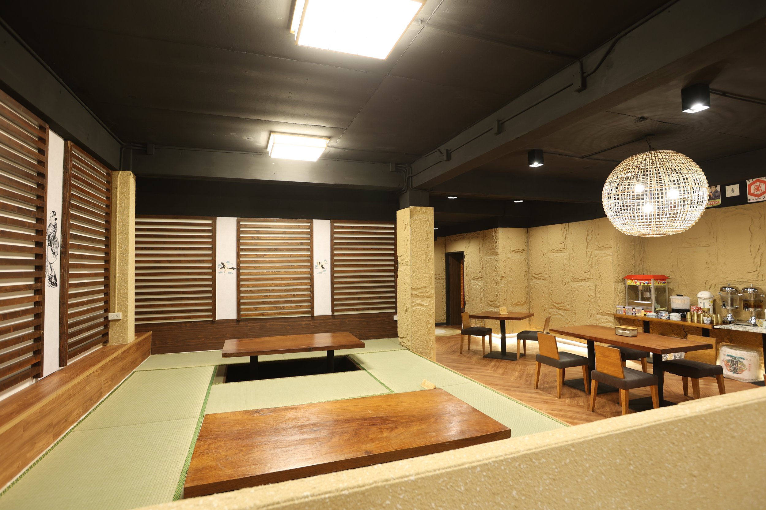Tatami dining room with sunken tables and rattan lantern at Maxwell Onsen Bangkok
